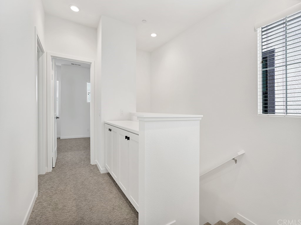 524 Caleigh Lane Costa Mesa, CA 92627 - Photo 16 of 19 a view of a hallway with windows
