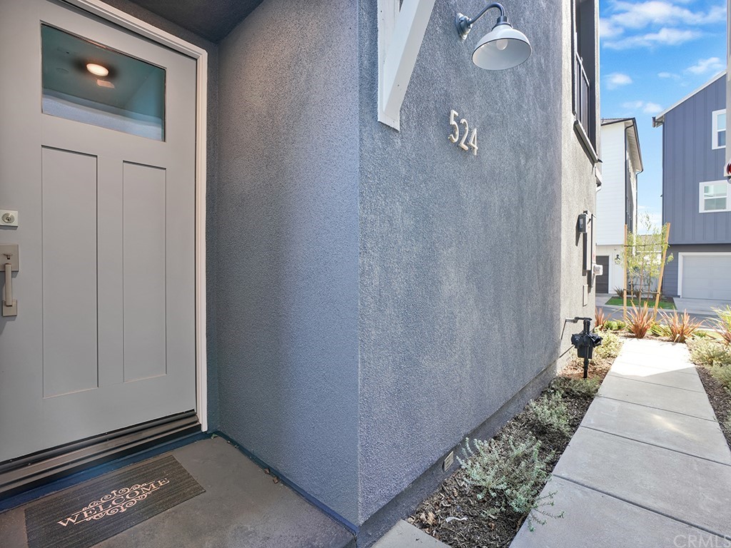 524 Caleigh Lane Costa Mesa, CA 92627 - Photo 2 of 19 a view of a livingroom with furniture and front door