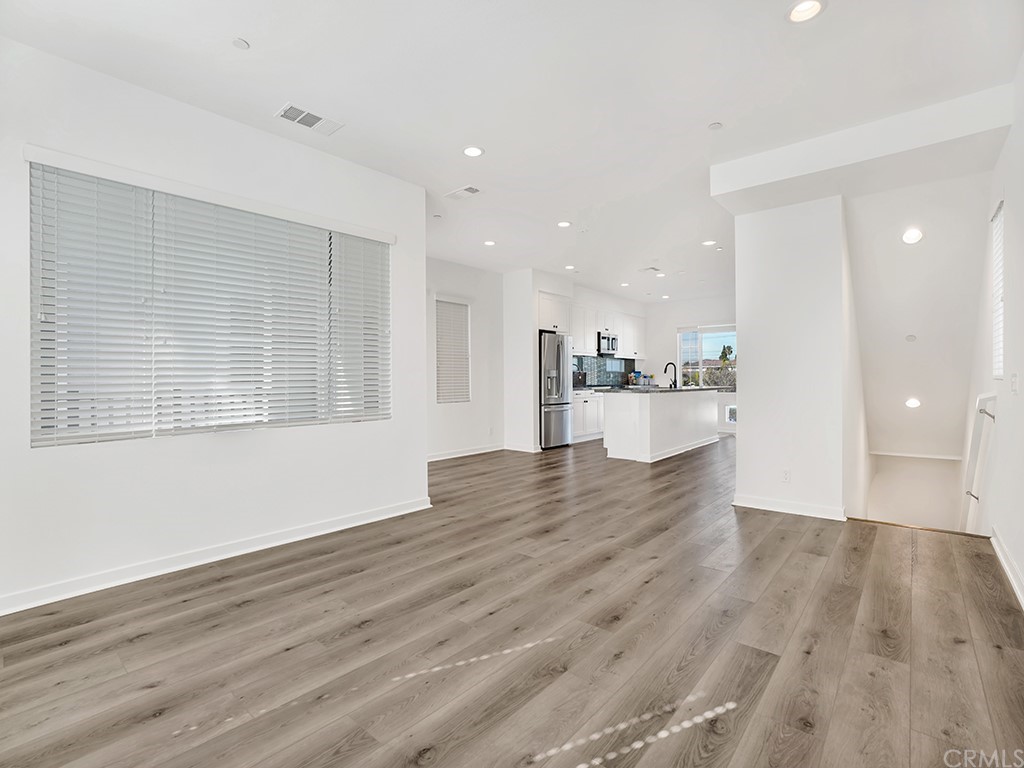 524 Caleigh Lane Costa Mesa, CA 92627 - Photo 9 of 19 a view of a kitchen with a sink and wooden floor