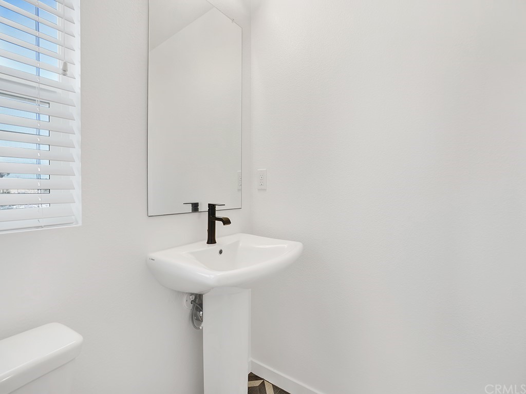 524 Caleigh Lane Costa Mesa, CA 92627 - Photo 10 of 19 a sink and a mirror