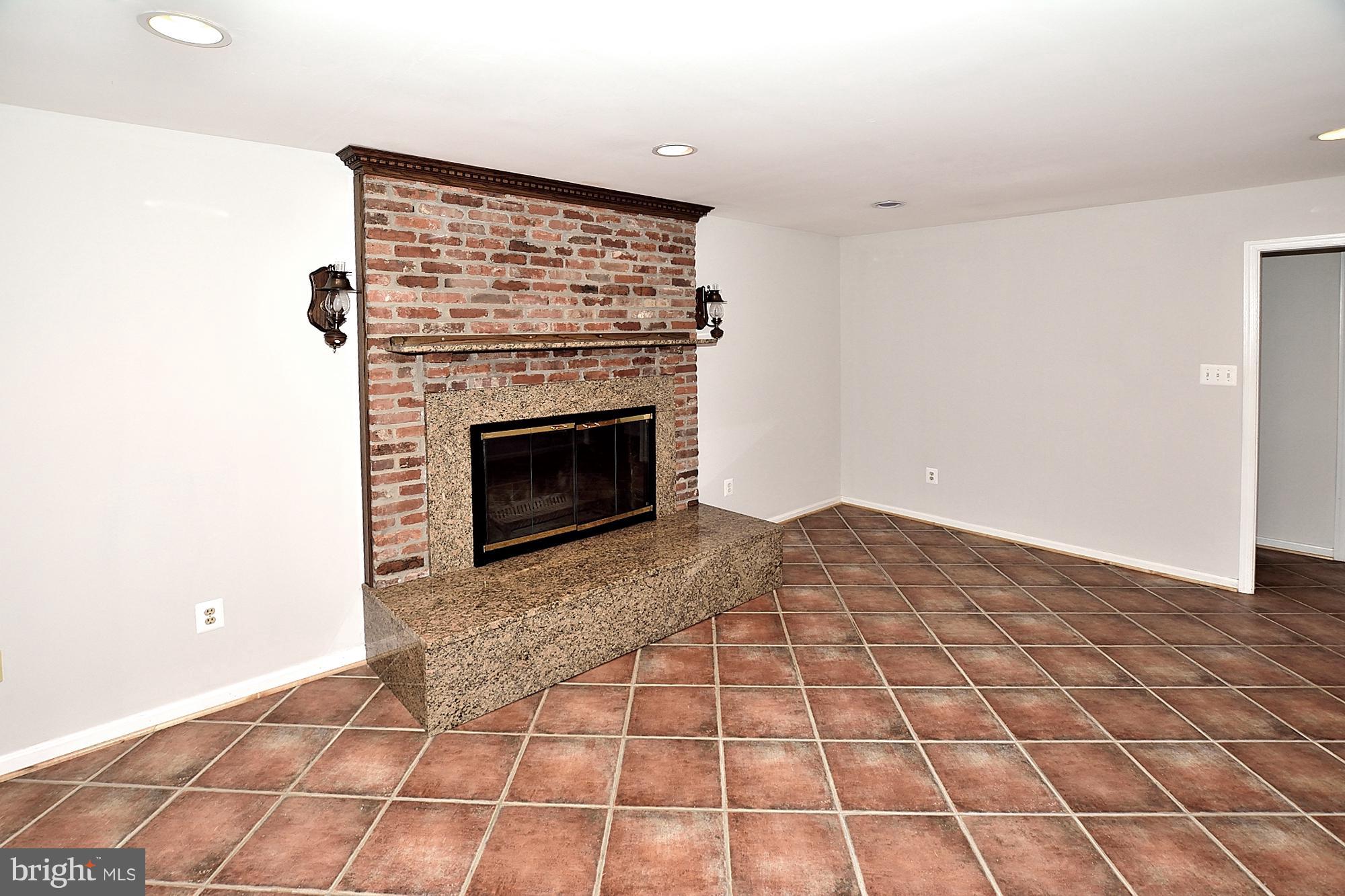 11093 Robert Carter Road Fairfax Station, VA 22039 - Photo 13 of 30 a view of empty room with fireplace