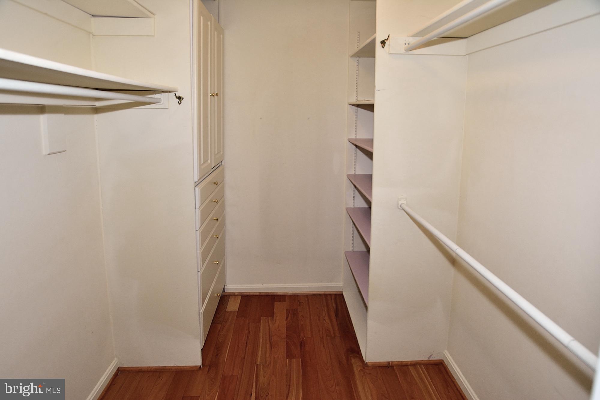 11093 Robert Carter Road Fairfax Station, VA 22039 - Photo 16 of 30 a view of walk in closet with wooden floor