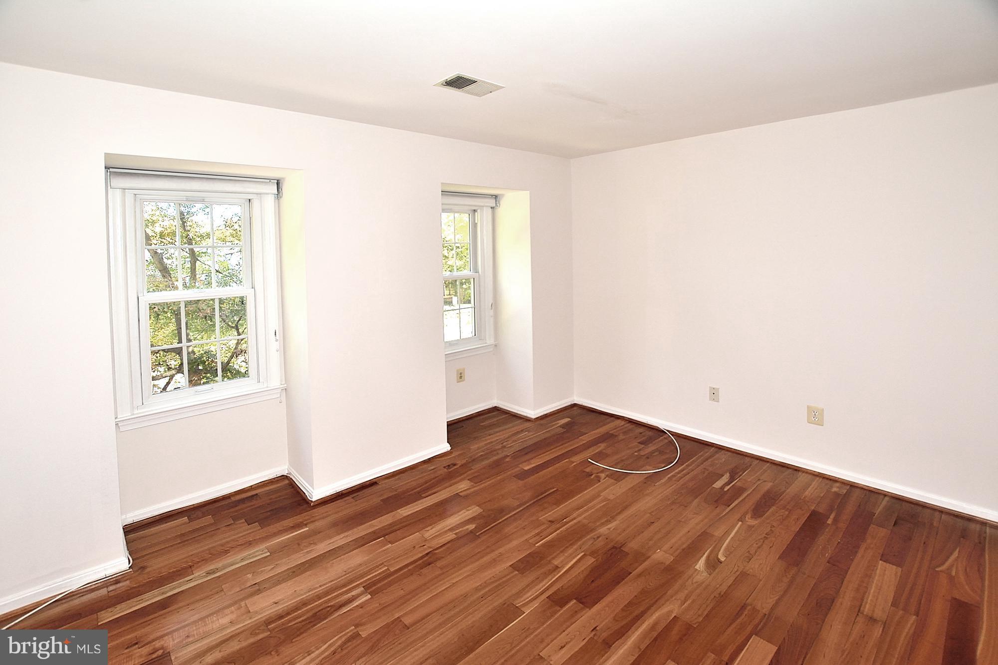 11093 Robert Carter Road Fairfax Station, VA 22039 - Photo 19 of 30 a view of empty room with wooden floor and fan
