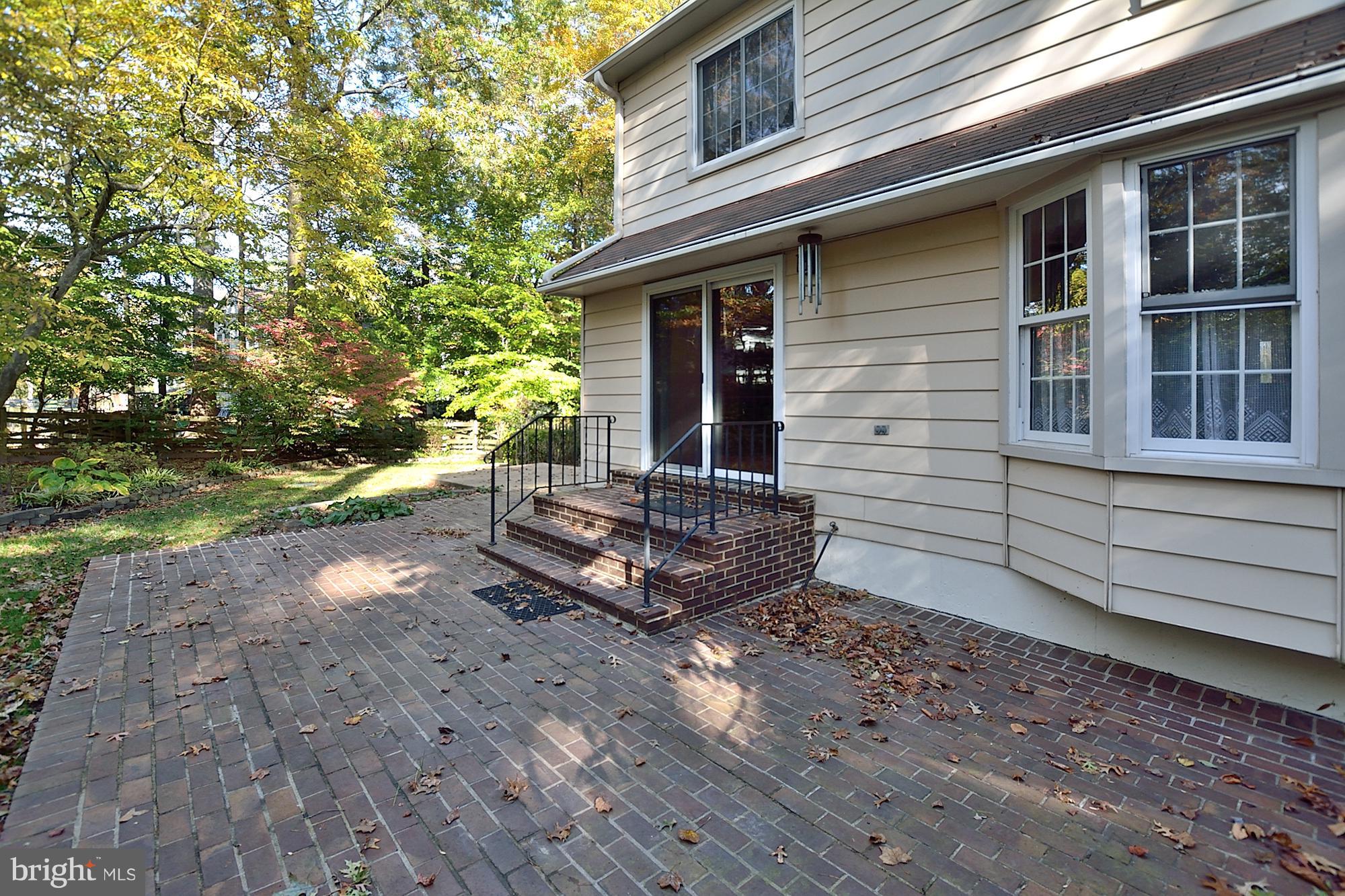 11093 Robert Carter Road Fairfax Station, VA 22039 - Photo 28 of 30 a view of a small house with backyard and sitting area