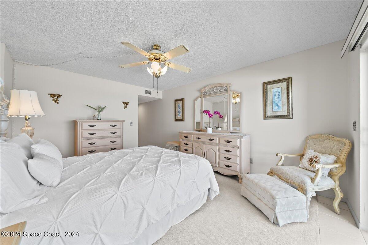 2725 North Hwy A1A, Unit 403 Indialantic, FL 32903 - Photo 15 of 37 a bedroom with a bed and furniture