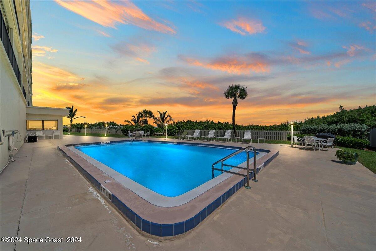 2725 North Hwy A1A, Unit 403 Indialantic, FL 32903 - Photo 2 of 37 a view of a swimming pool with a lounge chair