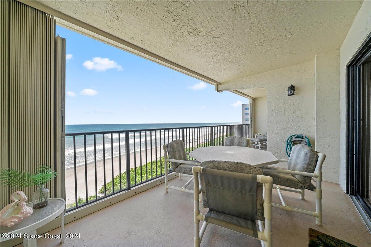 2725 North Hwy A1A, Unit 403 Indialantic, FL 32903 - Photo 24 of 37 a view of a dining room with furniture and a window