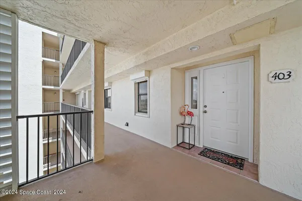 a view of a hallway with staircase