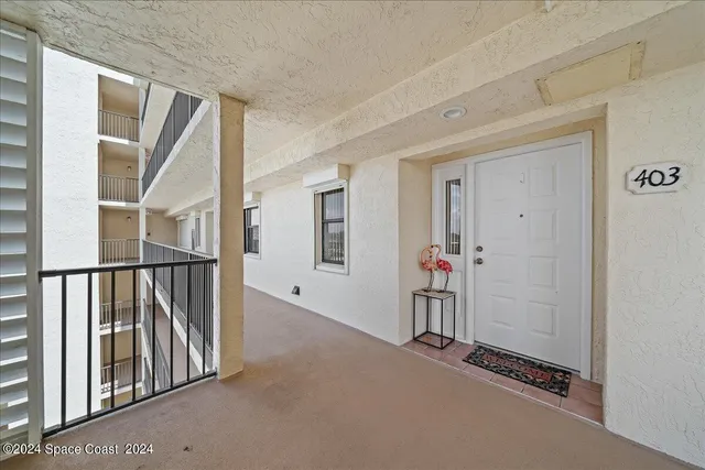 a view of a hallway with staircase