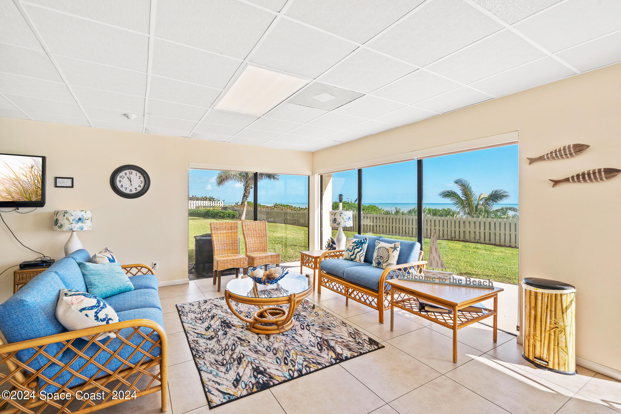 2725 North Hwy A1A, Unit 403 Indialantic, FL 32903 - Photo 31 of 37 a living room with furniture and a floor to ceiling window