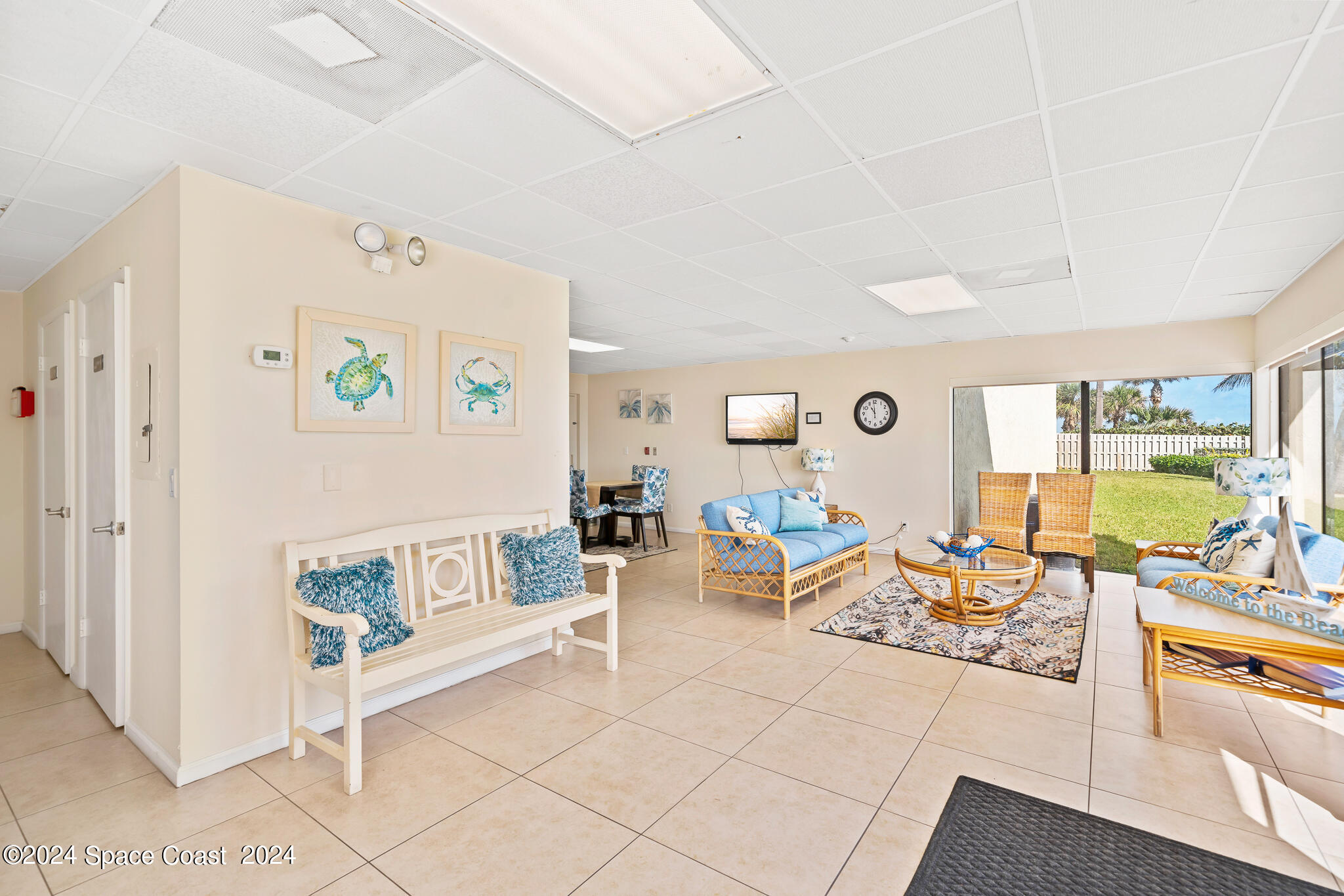 2725 North Hwy A1A, Unit 403 Indialantic, FL 32903 - Photo 34 of 37 a living room with furniture and a table