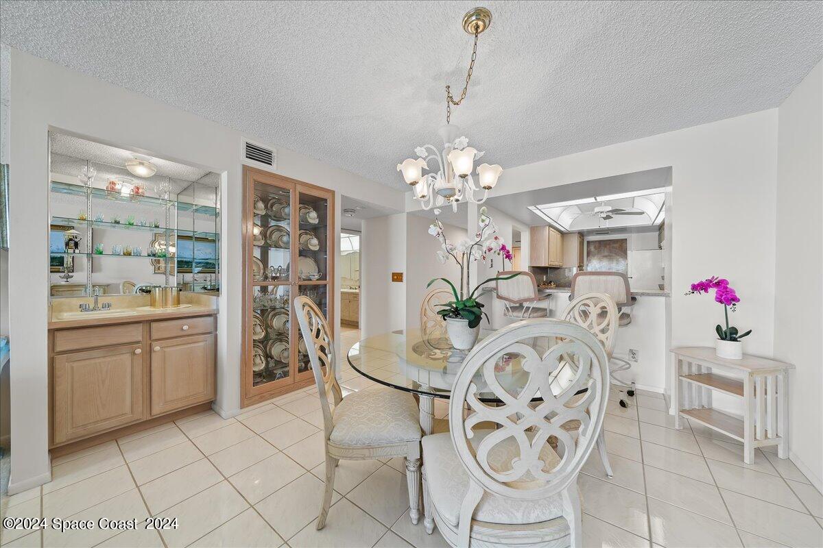 2725 North Hwy A1A, Unit 403 Indialantic, FL 32903 - Photo 10 of 37 a very nice looking dining room with a table and chairs