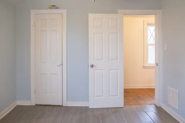a view of front door with wooden floor