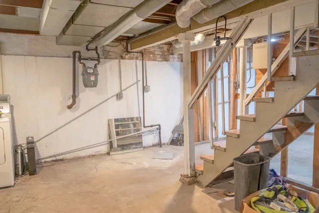 a view of living room with furniture and entryway