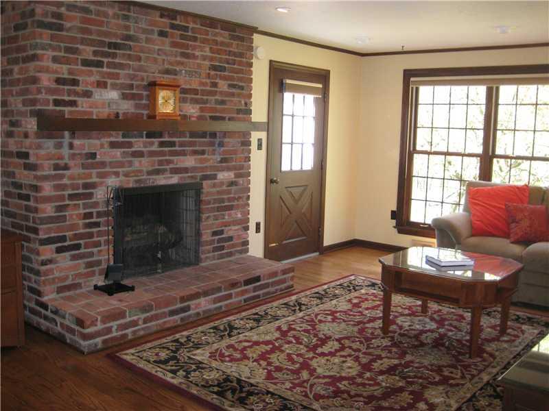 316 Wildberry Road Fox Chapel, PA 15238 - Photo 6 of 20 Family Room. Framed by brick fireplace with gas starter, the family room has hardwood floors,recessed lighting, a wet bar and door out to brick patio.