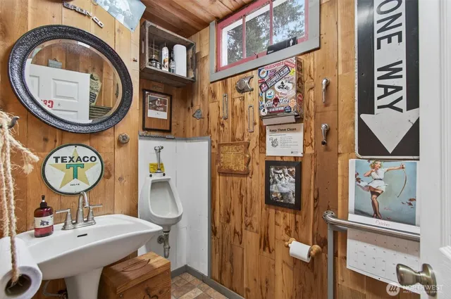 a bathroom with a sink a mirror and a toilet