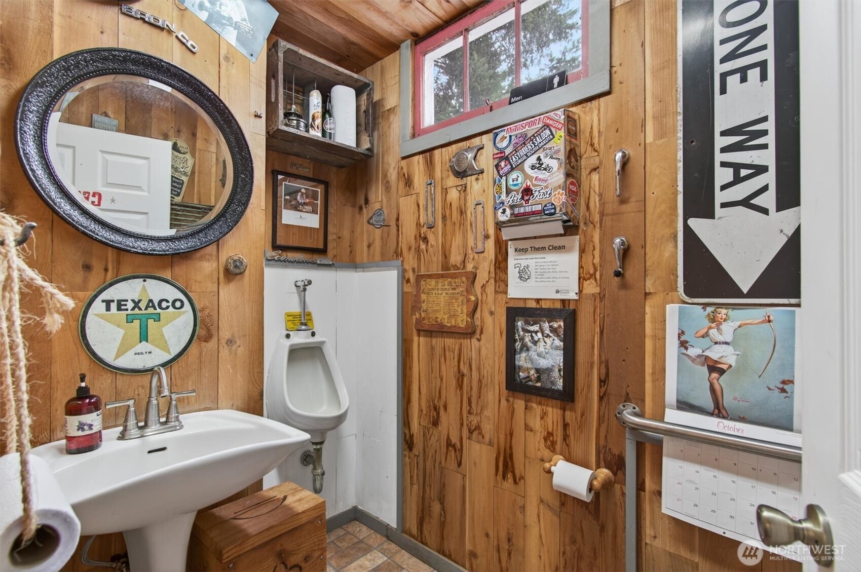 8 Fairgrounds Road Skamokawa, WA 98647 - Photo 14 of 40 a bathroom with a sink a mirror and a toilet