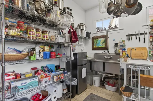 a store room with lots of clutter and cars
