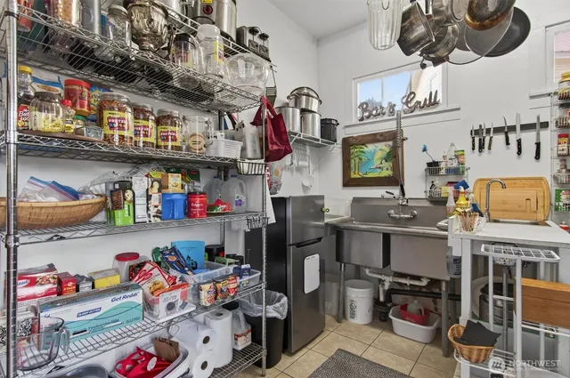 a store room with lots of clutter and cars
