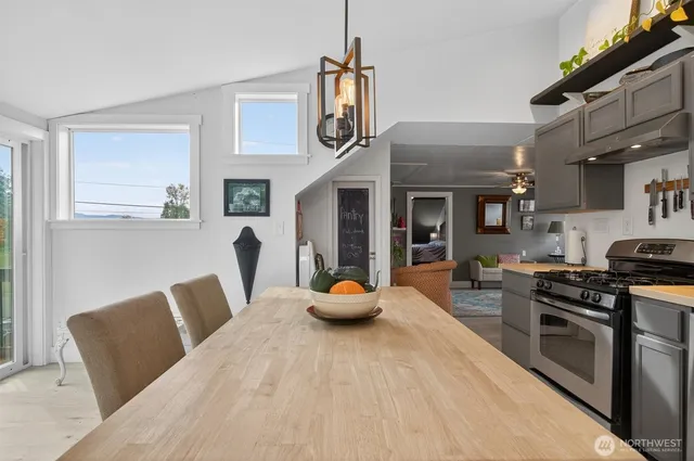 a bathroom with a sink a toilet and shower curtain