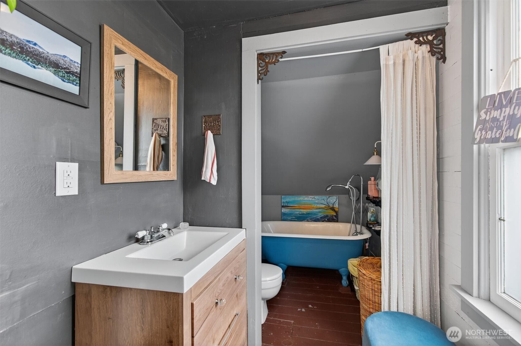 8 Fairgrounds Road Skamokawa, WA 98647 - Photo 29 of 40 a bathroom with a sink a toilet and shower curtain