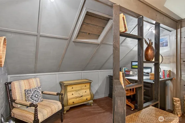 a view of a two chairs and table in the balcony