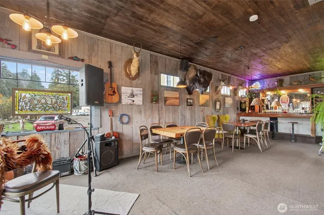 a view of a chairs and tables in a room