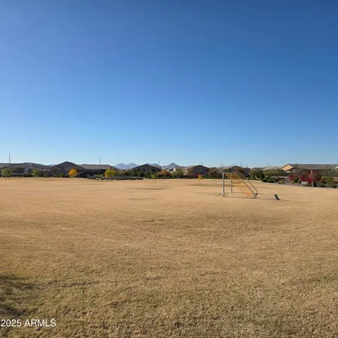 an aerial view of a house with a swimming pool yard and outdoor seating