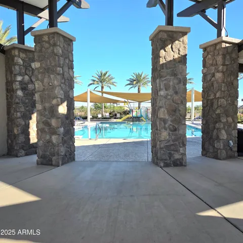 a view of a patio with wooden fence