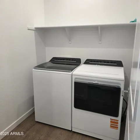 a bathroom with a shower sink and mirror