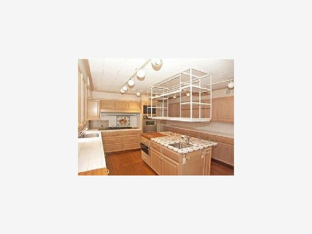 259 Bridge Road Hillsborough, CA 94010 - Photo 6 of 9 a living room with stainless steel appliances kitchen island granite countertop a sink and cabinets