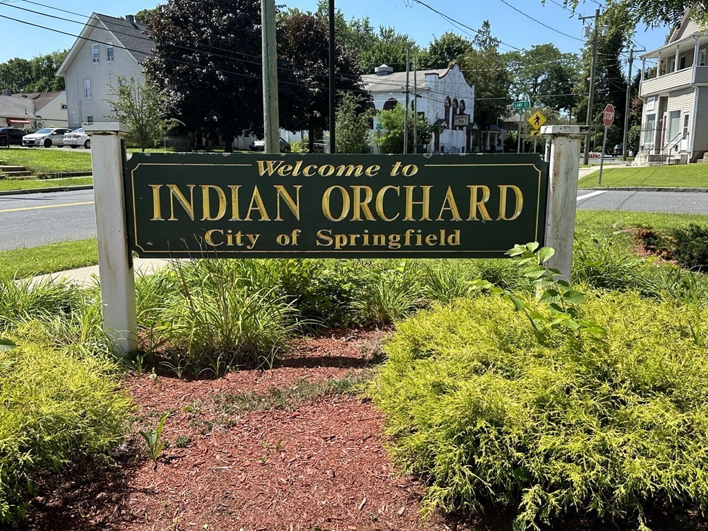 75 Parker Street Springfield, MA 01151 - Photo 4 of 28 a sign broad in front of flowers