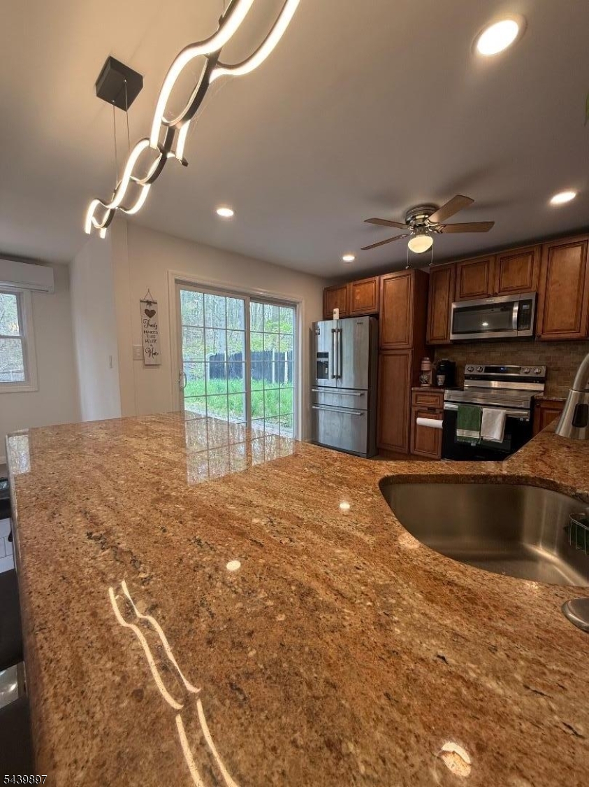 22 Karen Road Vernon, NJ 07422 - Photo 14 of 26 a view of kitchen with furniture and a ceiling fan