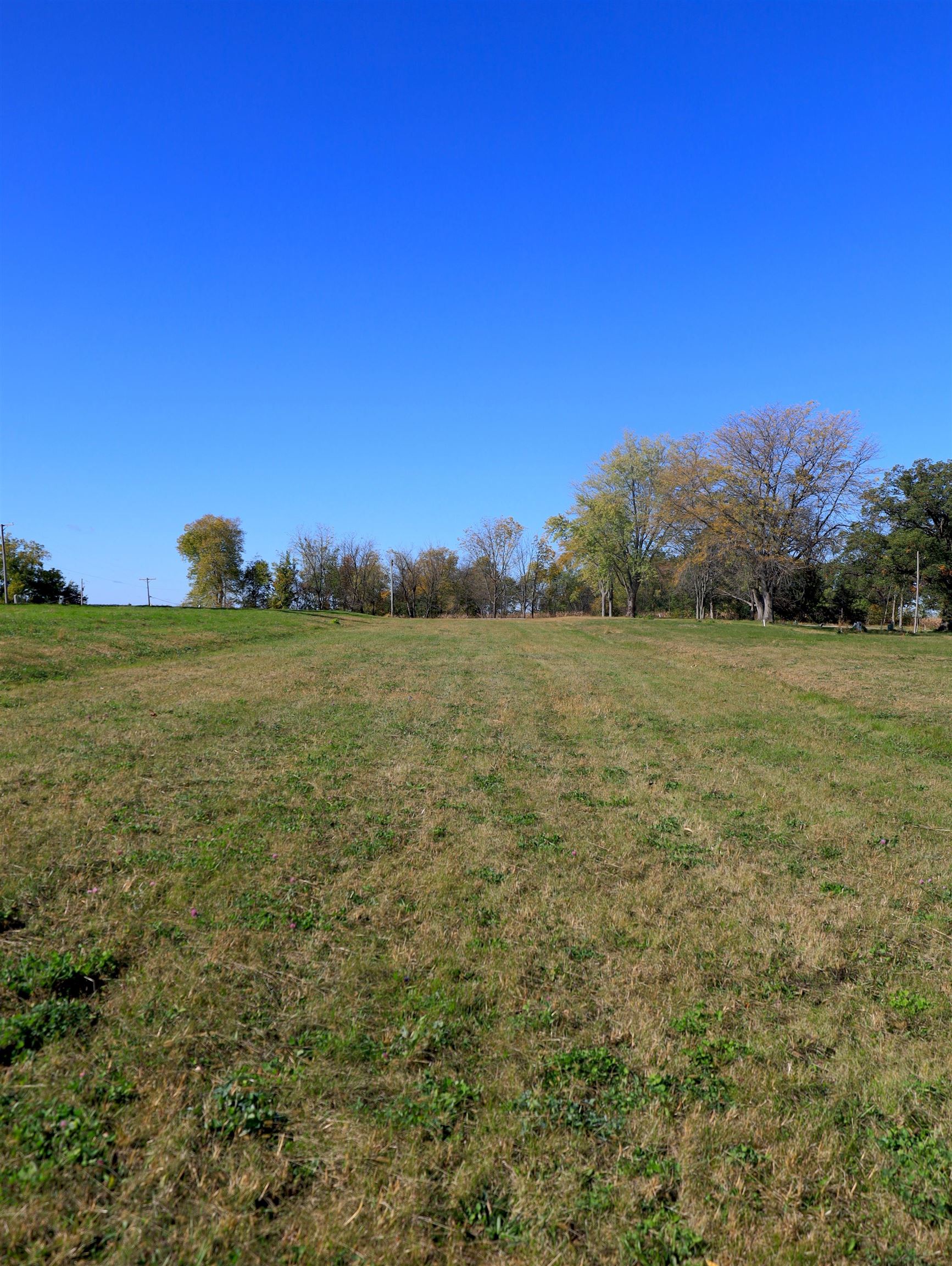 4500 East River Road Ridott, IL 61067 - Photo 20 of 37 a view of a field with an ocean