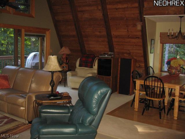5838 Fairland Road Clinton, OH 44216 - Photo 8 of 25 GREAT ROOM - EXTENDS BACK TO ADDL SPACE AND DINING ROOM AREA WITH NEWER HARDWOOD HICKORY FLOORING