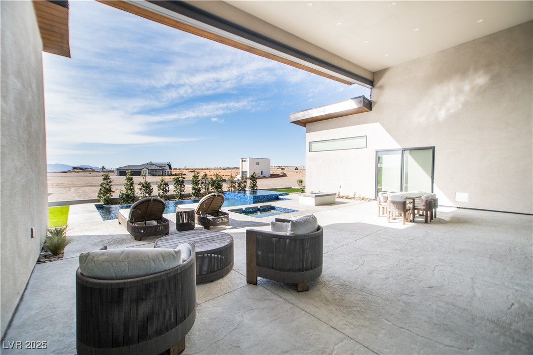 3030 South Formula Court Pahrump, NV 89048 - Photo 40 of 48 View of patio / terrace featuring a fenced in pool