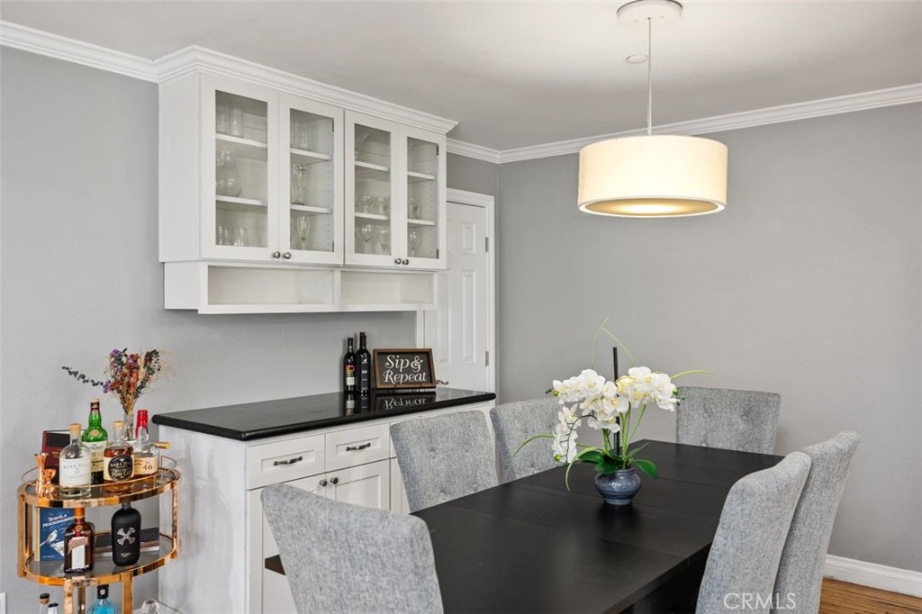 96 Clearbrook, Unit 32 Irvine, CA 92614 - Photo 1 of 1 a dining room with furniture and chandelier