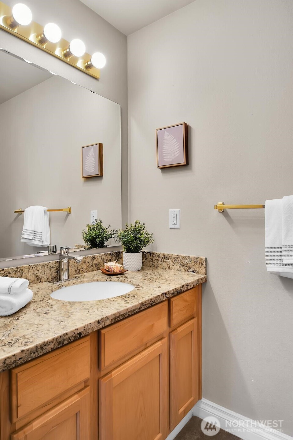 18524 114th Avenue Southeast Renton, WA 98055 - Photo 13 of 20 a bathroom with a granite countertop sink and a mirror