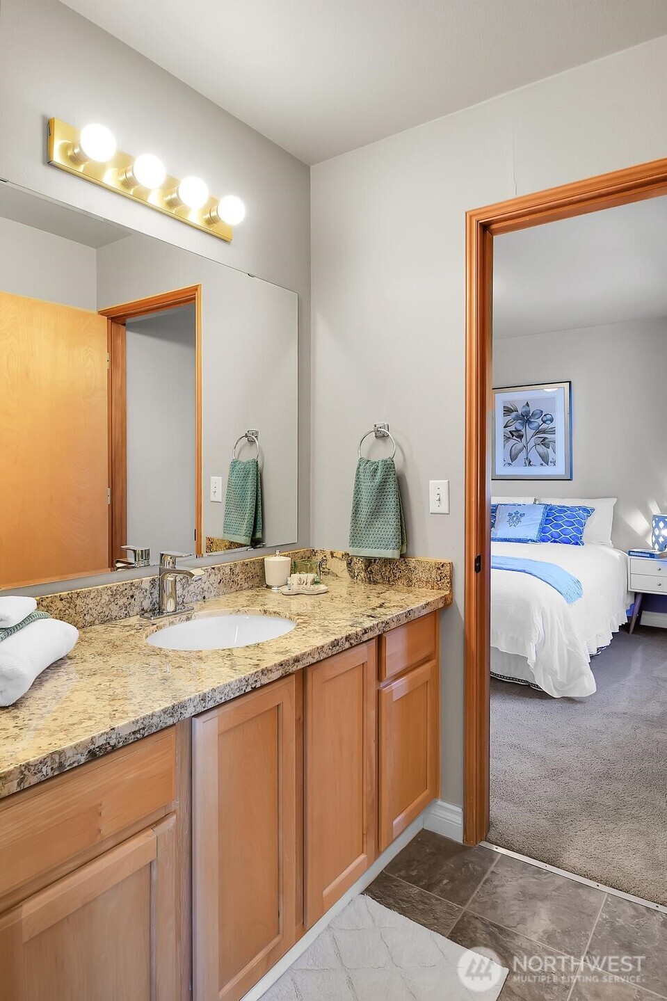 18524 114th Avenue Southeast Renton, WA 98055 - Photo 19 of 20 a en suite bathroom with a granite countertop sink and a mirror