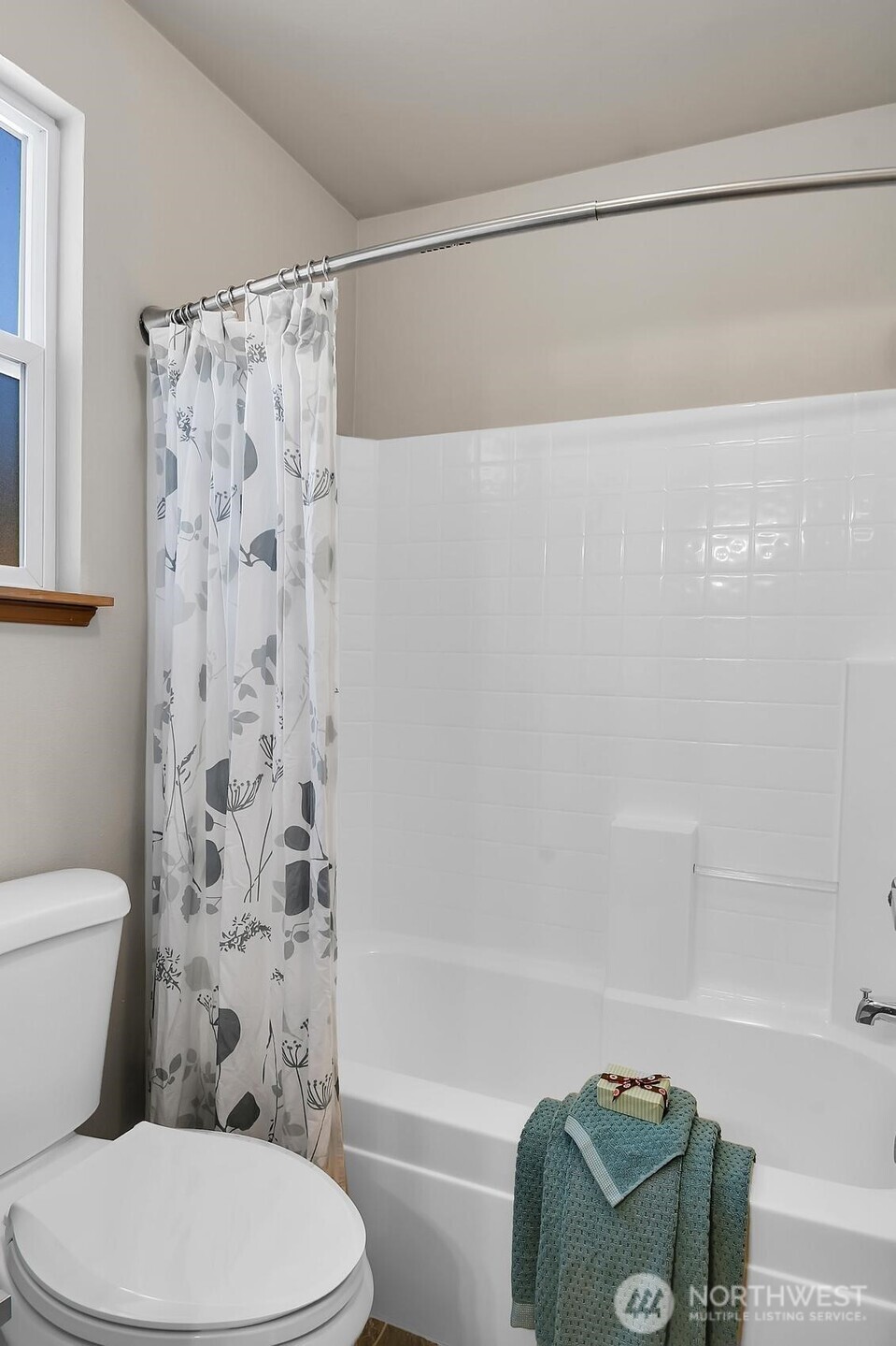18524 114th Avenue Southeast Renton, WA 98055 - Photo 20 of 20 a bathroom with a toilet and a shower curtain