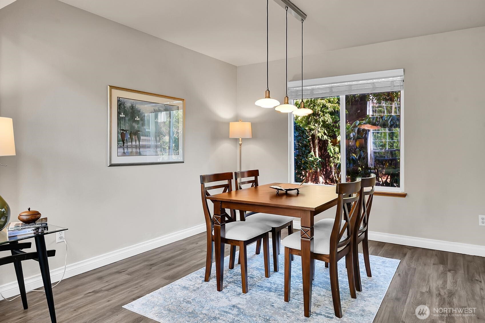 18524 114th Avenue Southeast Renton, WA 98055 - Photo 6 of 20 a view of a dining room with furniture window and wooden floor