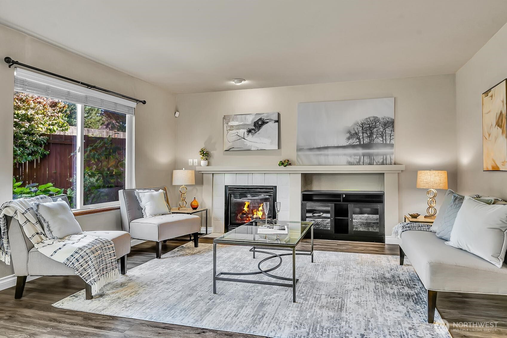 18524 114th Avenue Southeast Renton, WA 98055 - Photo 10 of 20 a living room with furniture and a fireplace