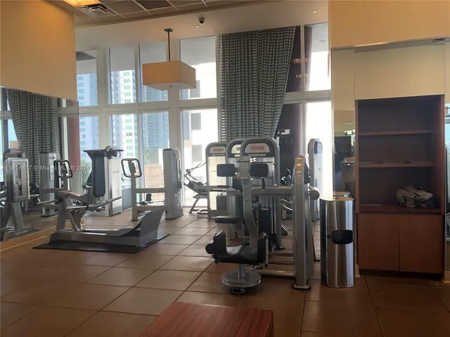 a view of a dining room with gym equipment