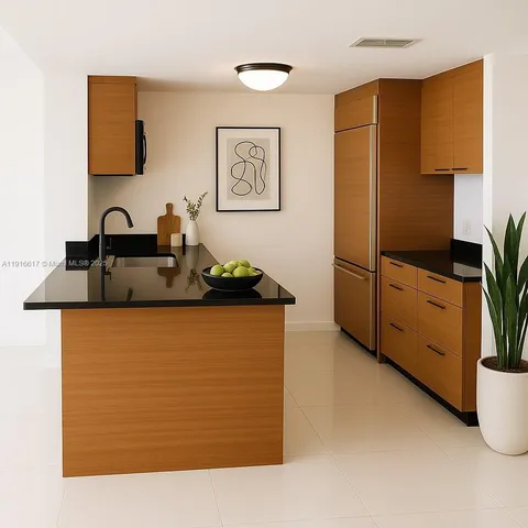 a kitchen with stainless steel appliances granite countertop a refrigerator and a stove