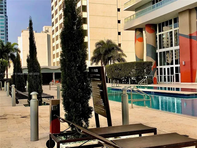 a view of a patio with a table chairs