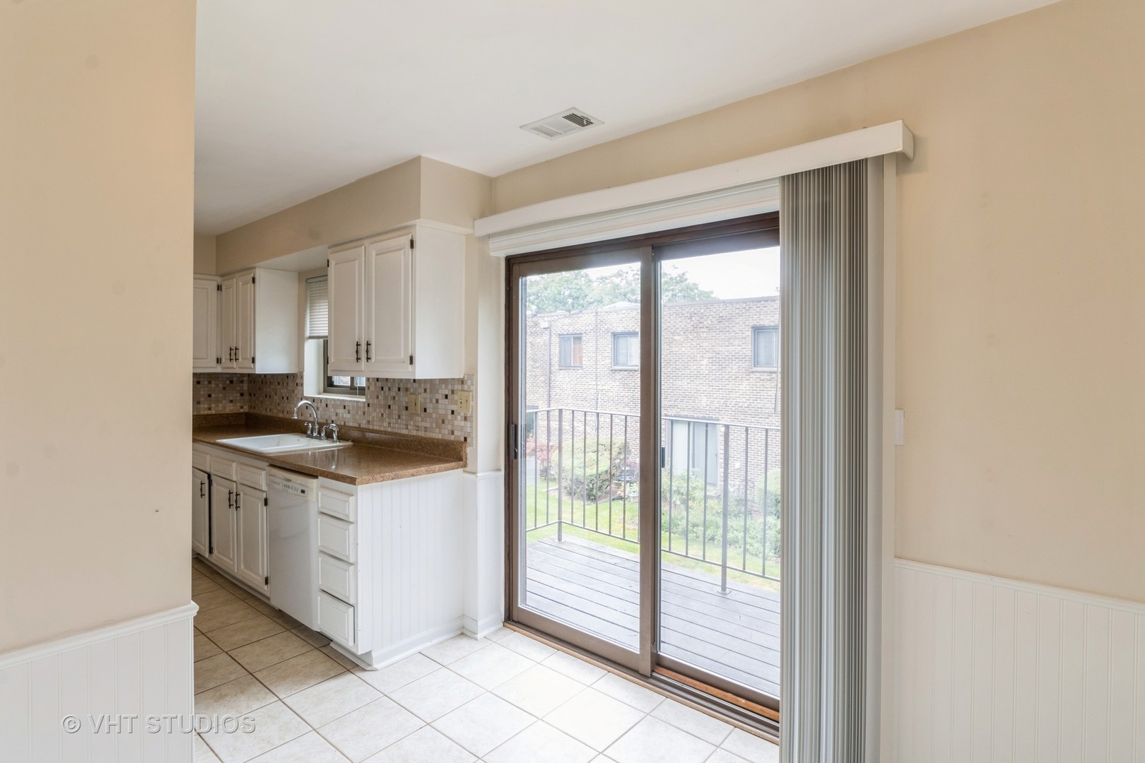 348 East Rimini Court, Unit 348 Palatine, IL 60067 - Photo 5 of 10 a kitchen with a sink and a stove top oven