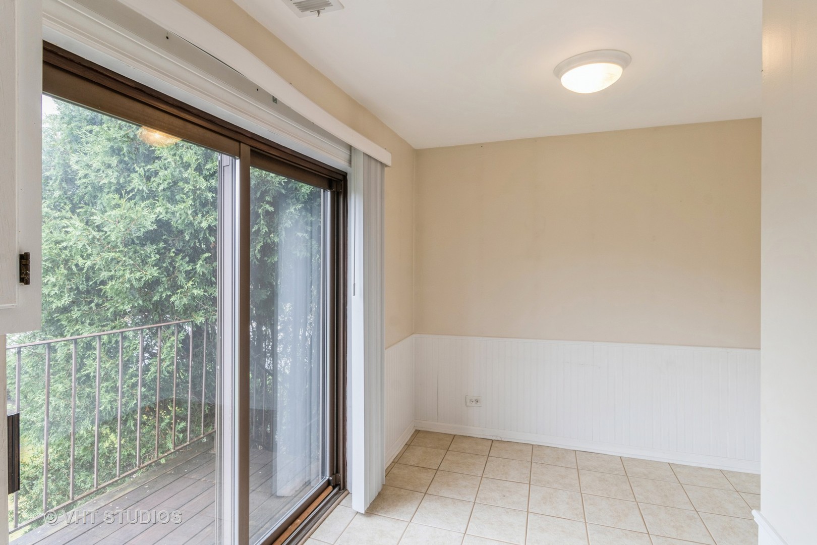 348 East Rimini Court, Unit 348 Palatine, IL 60067 - Photo 6 of 10 a view of an empty room with wooden floor and a window