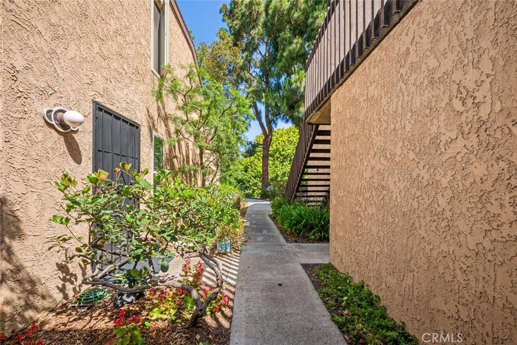 7890 East Spring Street, Unit 15D Long Beach, CA 90815 - Photo 2 of 40 Front door has a security screen for cross breeze