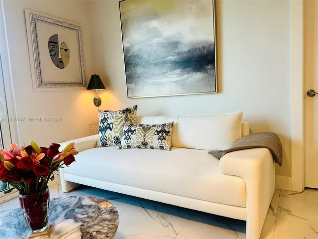 a bedroom with a bed and ceiling fan