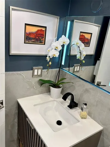 a view of a lake with a big yard and large trees